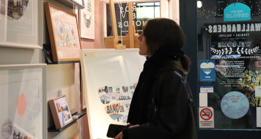 Person admiring art on the wall